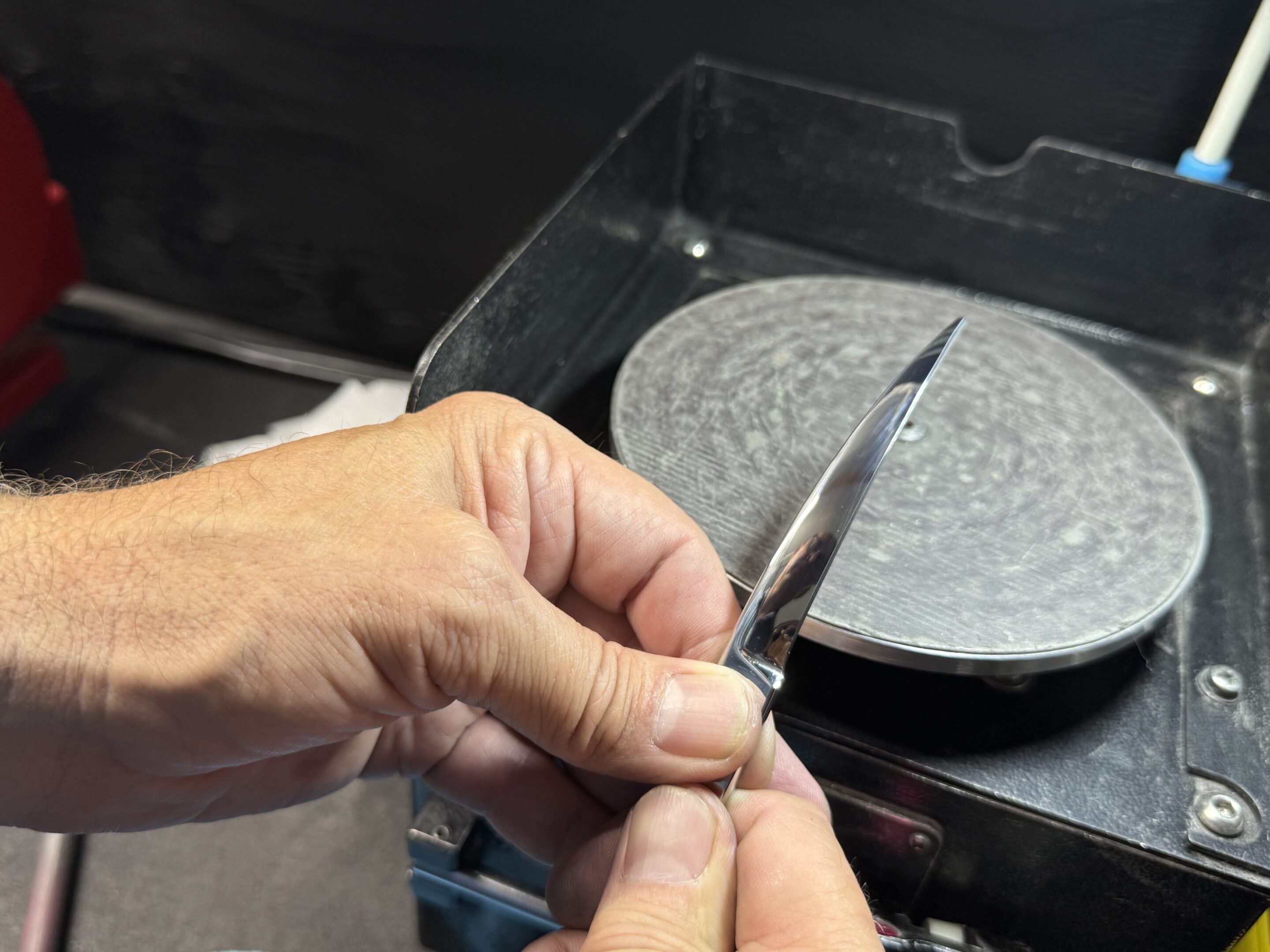 Freshly sharpened shear blade, restored to a flawless convex edge for precision cutting.